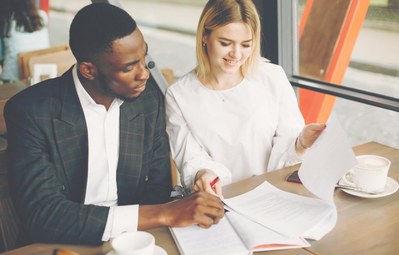 Business professionals analyzing financial data and charts